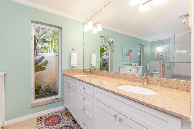 bathroom featuring vanity, an enclosed shower, tile patterned flooring, and crown molding