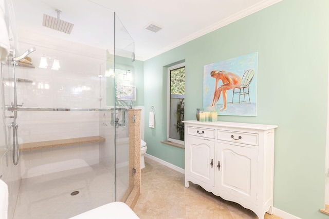 bathroom with toilet, crown molding, a shower with shower door, and tile patterned floors