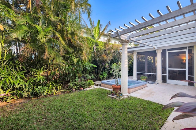 view of yard featuring a pergola and a sunroom