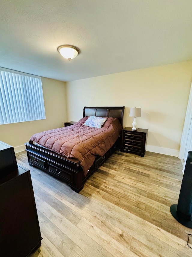 bedroom with light hardwood / wood-style flooring