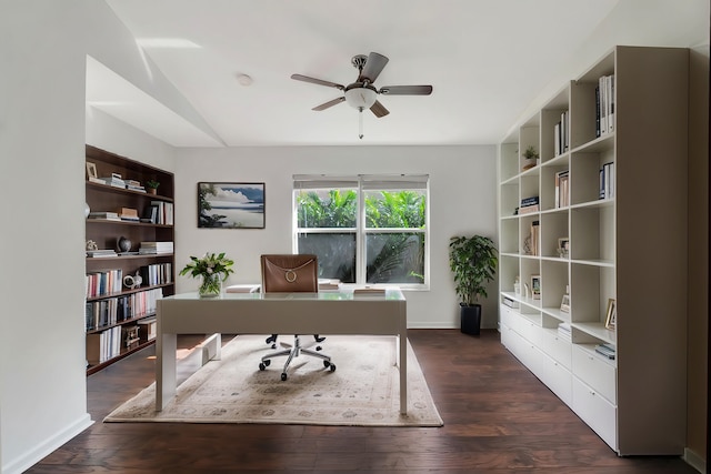 office area with ceiling fan, baseboards, vaulted ceiling, and dark wood finished floors