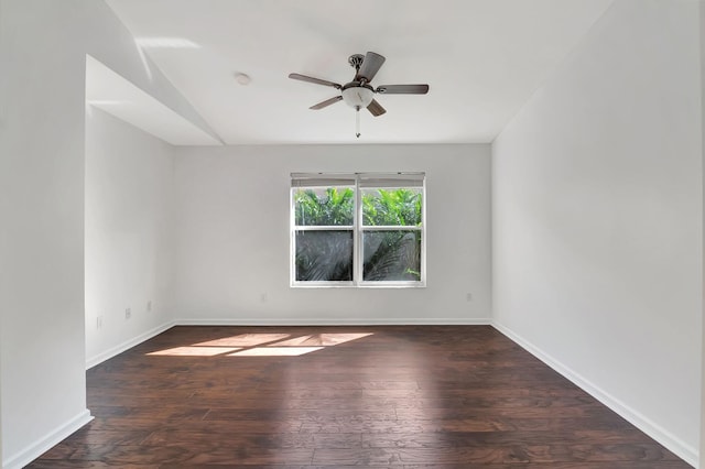 unfurnished room with baseboards, hardwood / wood-style flooring, and ceiling fan
