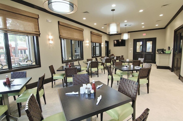 dining space featuring baseboards, visible vents, crown molding, and recessed lighting