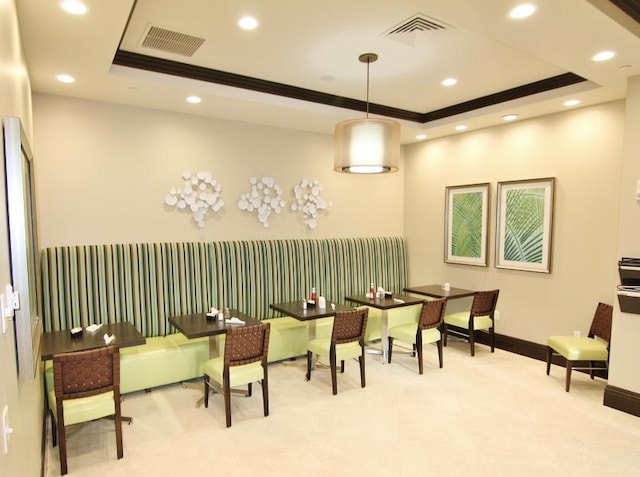interior space featuring visible vents, recessed lighting, and a tray ceiling