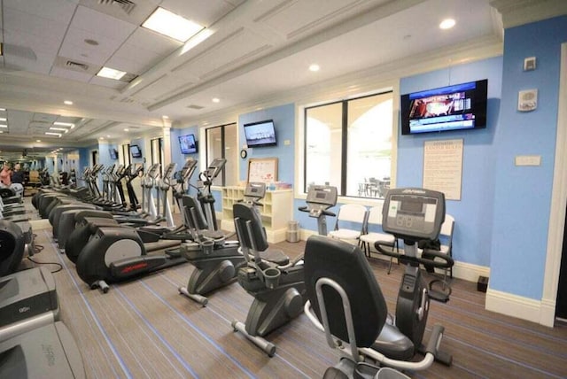 workout area with baseboards, visible vents, and carpet floors