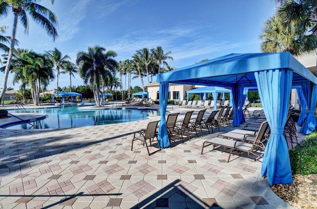 view of swimming pool with a gazebo and a patio area