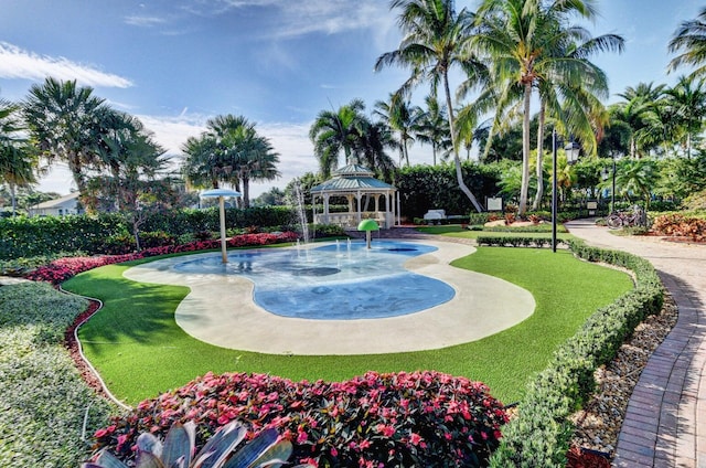 view of home's community with a yard and a gazebo