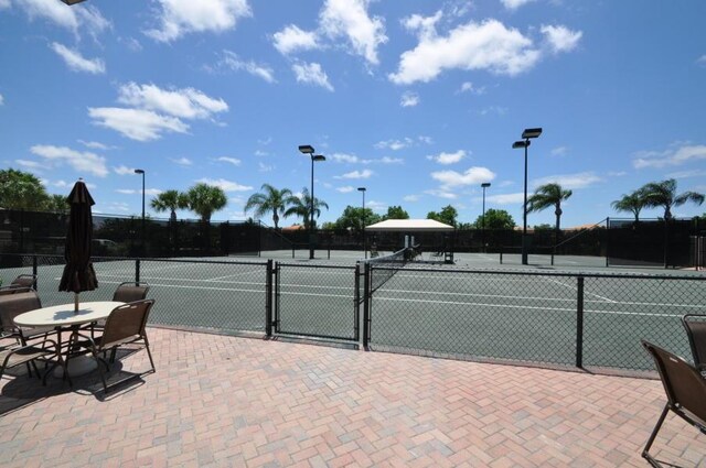 view of sport court with fence