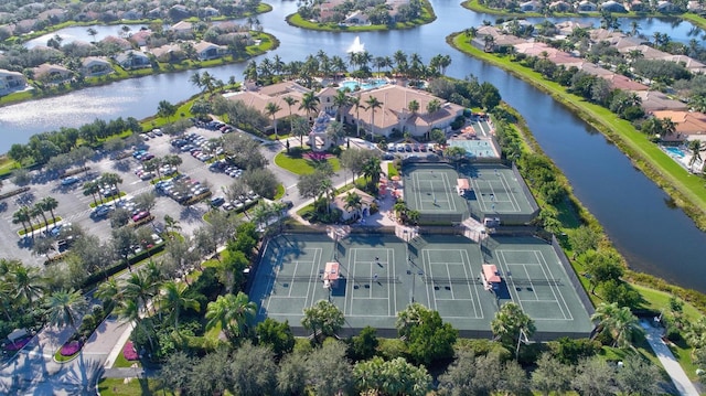 birds eye view of property with a residential view and a water view