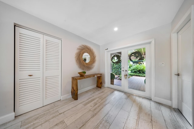 doorway to outside featuring french doors and light hardwood / wood-style floors