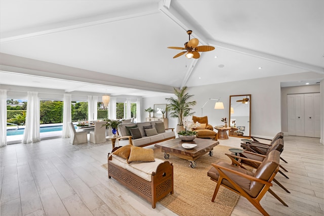 living room with beam ceiling, light wood-type flooring, high vaulted ceiling, and ceiling fan