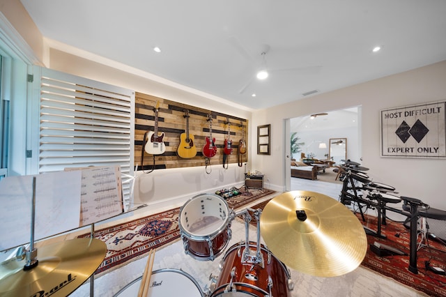 interior space with ceiling fan