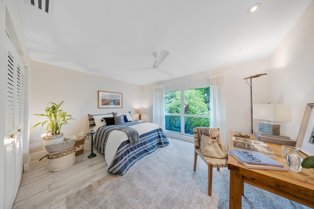 bedroom featuring light wood-type flooring and ceiling fan