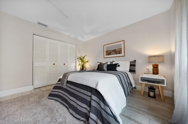 bedroom with a closet and light wood-type flooring