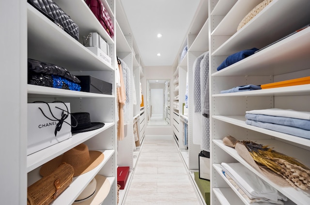 spacious closet featuring light hardwood / wood-style flooring