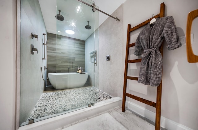 bathroom with shower with separate bathtub