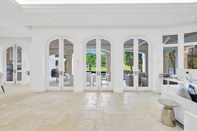 interior space featuring french doors and crown molding