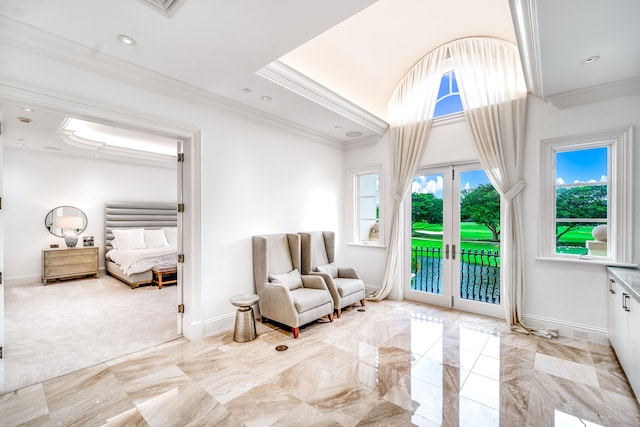 sitting room featuring french doors and crown molding