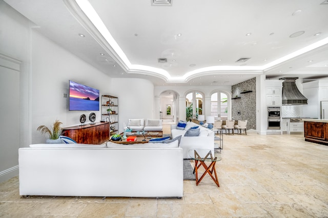 living room with a raised ceiling