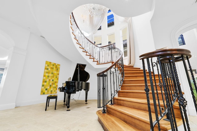 staircase with a wealth of natural light