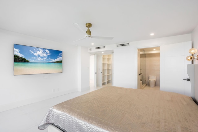 bedroom with a closet, a spacious closet, connected bathroom, and ceiling fan