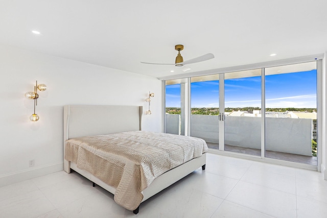 bedroom featuring ceiling fan, a wall of windows, and access to exterior