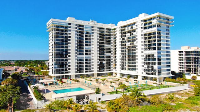 view of building exterior with a community pool