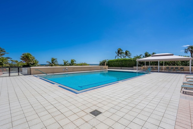 view of swimming pool with a patio