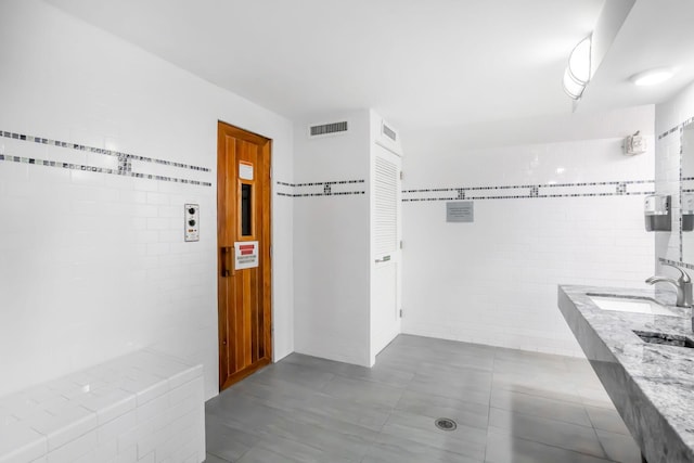 bathroom with vanity and tile patterned floors