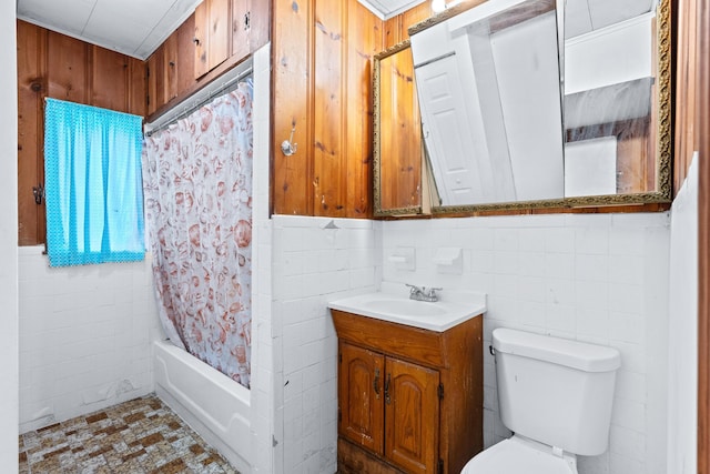 full bathroom with vanity, toilet, shower / bath combination with curtain, and tile walls