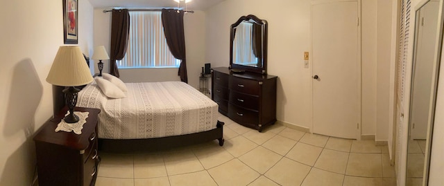 bedroom featuring light tile patterned flooring