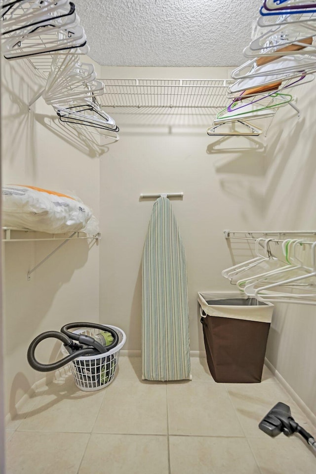 spacious closet with tile patterned flooring