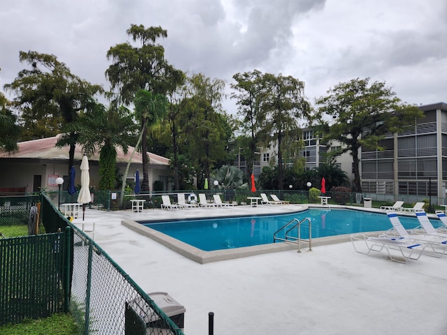 view of swimming pool with a patio area