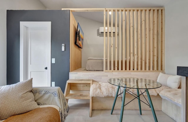 living area featuring an AC wall unit