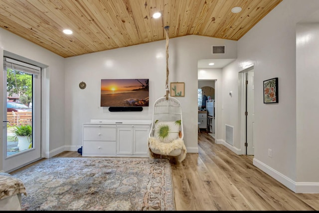 living room featuring light hardwood / wood-style flooring, wood ceiling, and vaulted ceiling