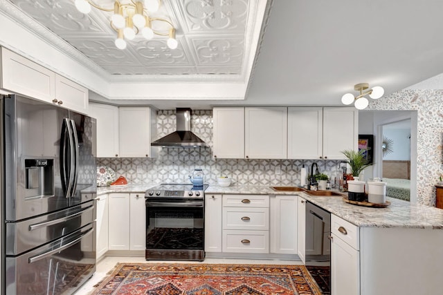 kitchen with white cabinets, sink, wall chimney exhaust hood, decorative backsplash, and stainless steel appliances