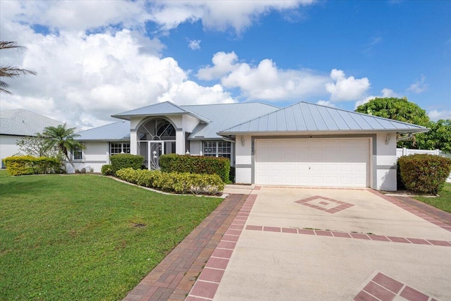 ranch-style house featuring a front yard and a garage