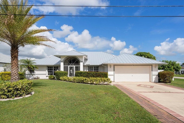 ranch-style house with a front yard and a garage