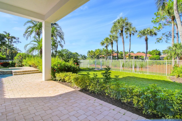 view of patio / terrace featuring an in ground hot tub