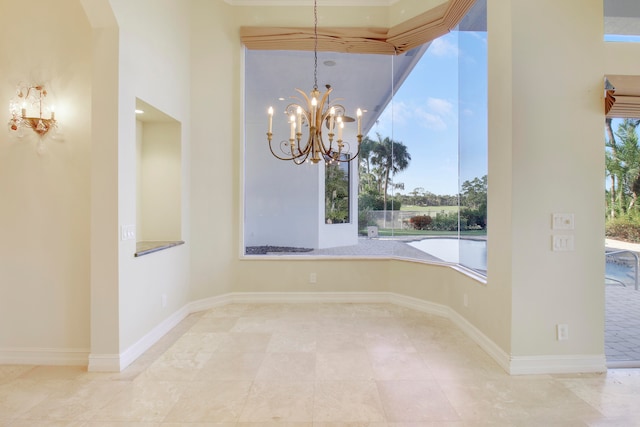 spare room with a chandelier