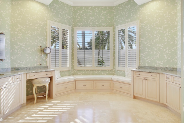 bathroom with a tub and crown molding