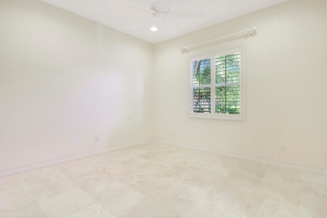 spare room with ceiling fan