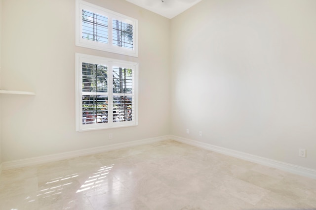 empty room featuring a high ceiling