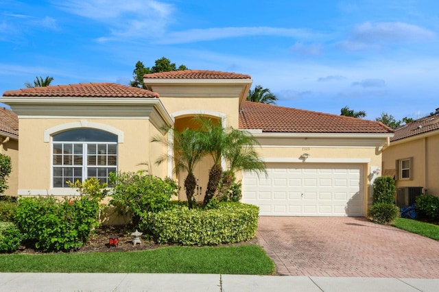 mediterranean / spanish-style house featuring a garage