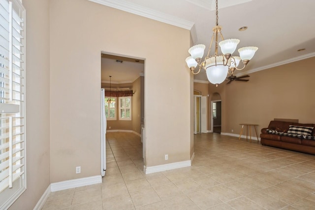 tiled spare room with ornamental molding and ceiling fan with notable chandelier