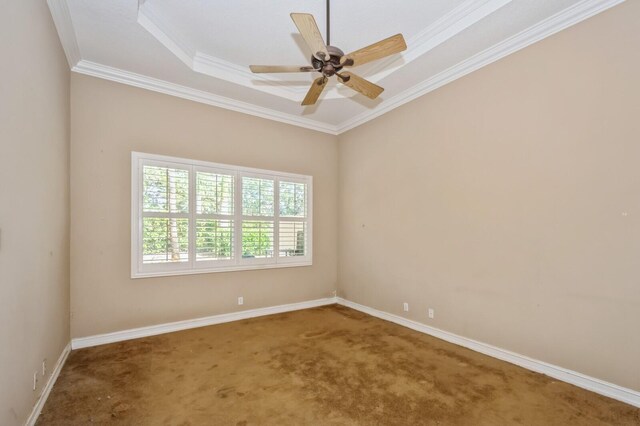 unfurnished room with crown molding, carpet floors, a raised ceiling, and ceiling fan