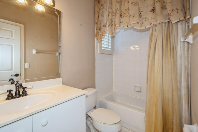 full bathroom with vanity, toilet, and shower / bath combo with shower curtain