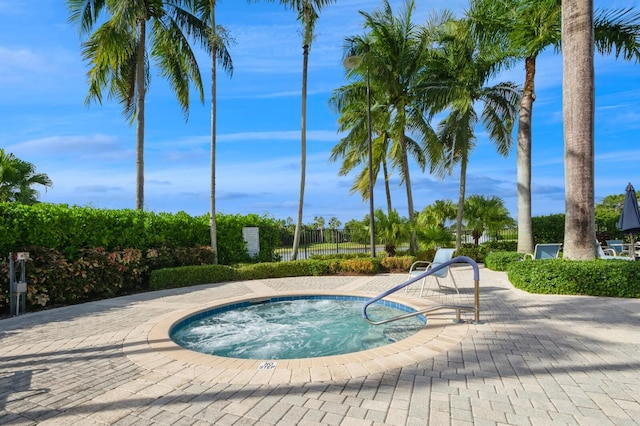 view of pool featuring a hot tub