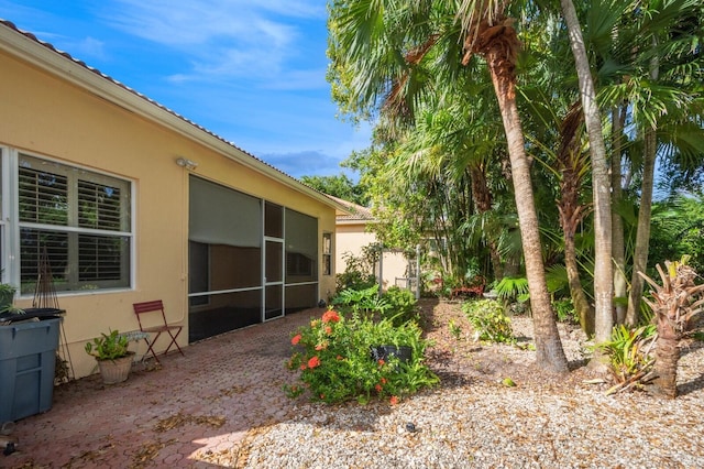 view of yard with a sunroom