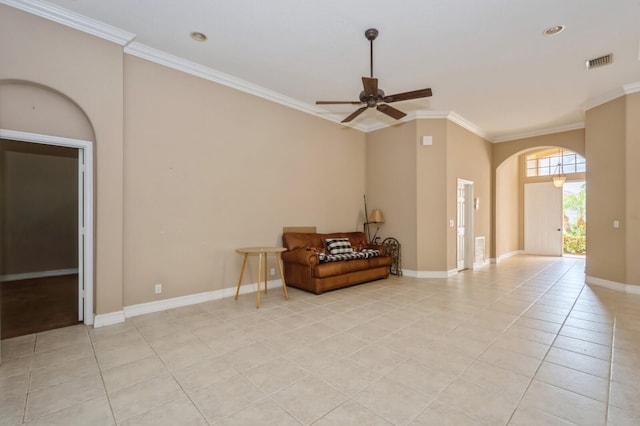 living area with crown molding, light tile patterned floors, and ceiling fan